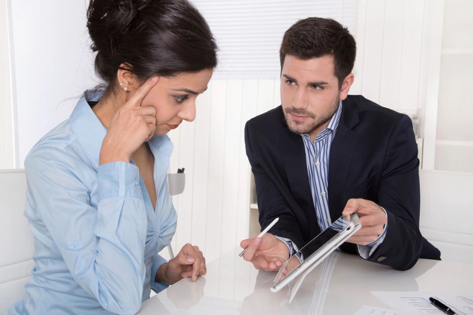 A man and woman are sitting at a table